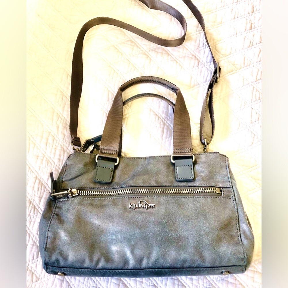 Kipling Grayish/Blue W/ a Slight Shine to it.